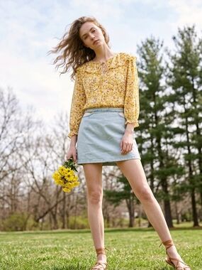 Yellow Floral Ruffle Tie-Neck Blouse, Cut Out Skirt And 2 Pairs Of Earrings.